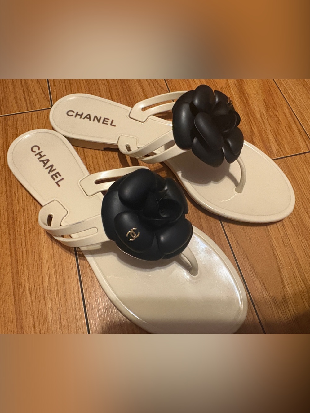 CHANEL Ivory Jelly Thong Sandals with Black Camellia Flower